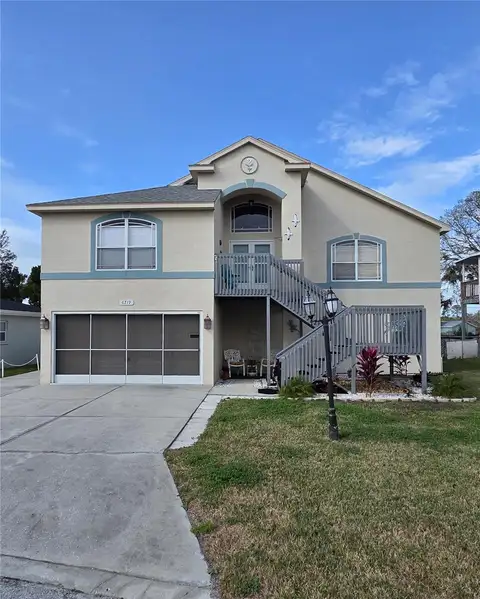 6719 MANOR BCH — home for sale